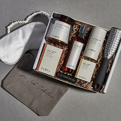 Luxury spa gift set with skincare products, eye mask, and foot file.