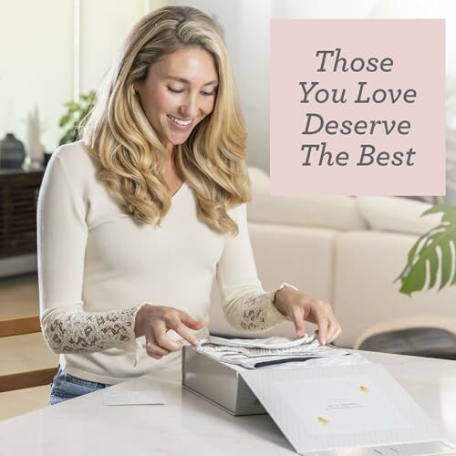 Woman smiling while opening a gift box with text 'Those You Love Deserve The Best'.