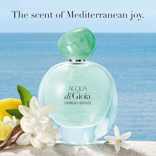 Acqua di Gioia perfume bottle by the sea with flowers and lemon.