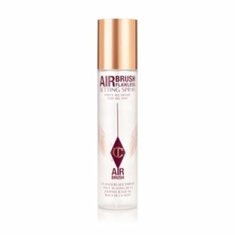Airbrush Flawless Setting Spray bottle with gold cap.