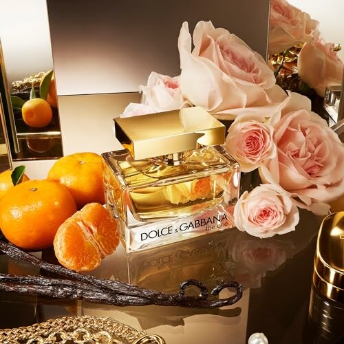 Dolce & Gabbana perfume with roses and oranges