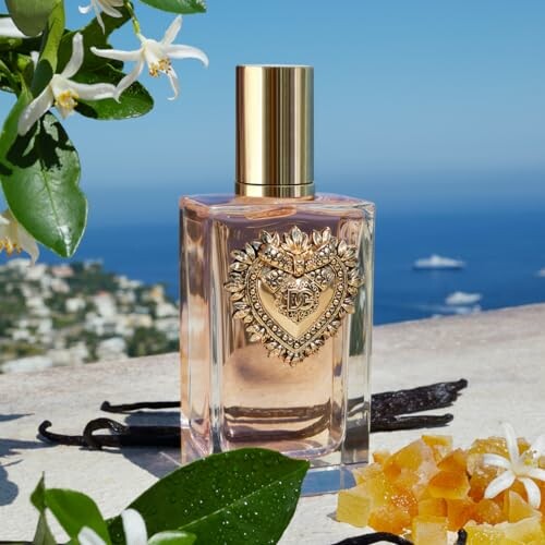 Luxurious perfume bottle with gold cap and emblem, set by the sea with flowers and citrus peels.