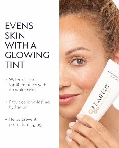 Woman holding Alastin skincare product with glowing tint benefits.
