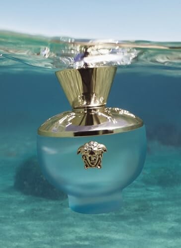 Versace perfume bottle submerged underwater.